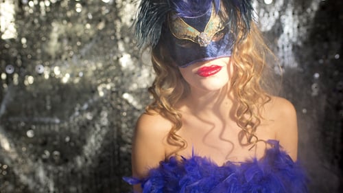 Woman Posing with Mask and Feather Boa