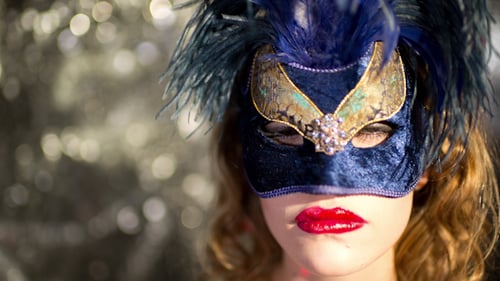 Woman in Blue Feathered Mask With Red Lipstick