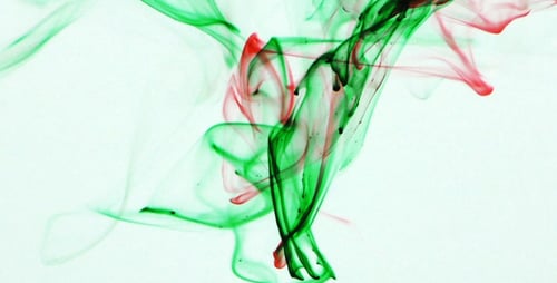 Red and Green Ink Swirling Abstractly