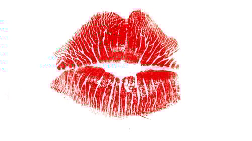 Animated Red Lipstick Kiss Marks Reveal on White Background