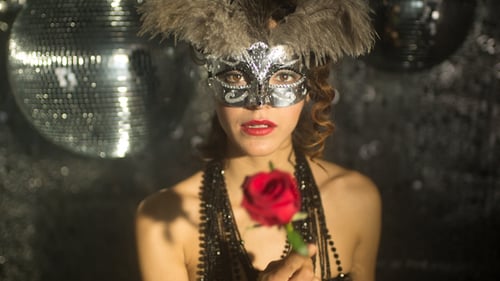 Glamorous Woman with Rose Wearing a Silver Mask