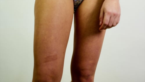 Woman Dancing in Sparkly Bra and Shorts