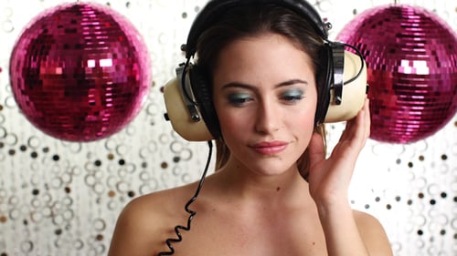 Woman Posing with Headphones and Disco Balls