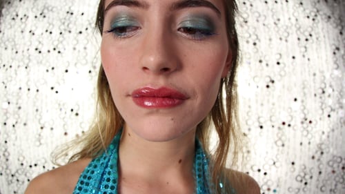 Young Blond Woman with Makeup Close Up