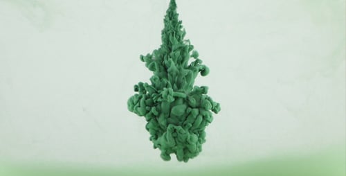 Green Ink Cloud Flowing Through Water
