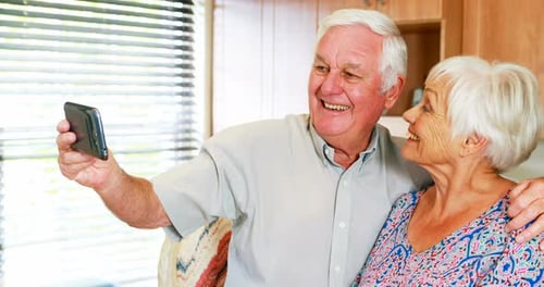 Senior Couple Taking a Selfie at Home Together