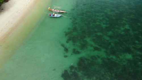 Fishing Boats Near Reef. Beautiful Aerial View of Fishing Boats Floating on Blue Sea Water Near