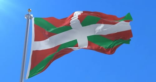 Basque Country Flag Waving in Wind Against Blue Sky
