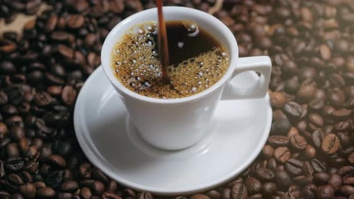 Hot Coffee Being Poured into a Cup