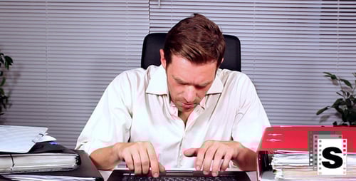 Man Typing on Laptop Falls Asleep at Desk