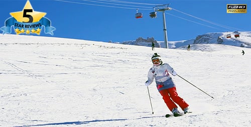 Skiers Enjoying Winter Holiday on Snowy Slopes