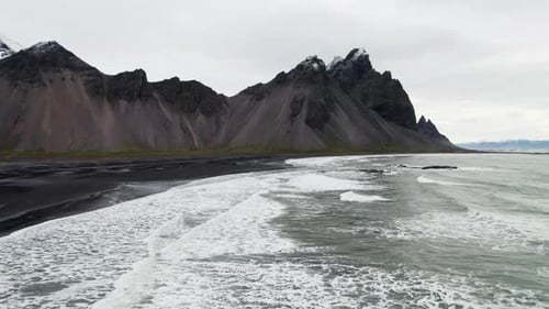 Drone Over Black Sand Beach Sea And Vestrahorn Mountain