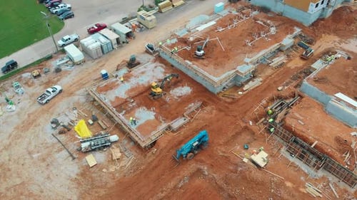 Aerial View of Construction Site with Heavy Machinery