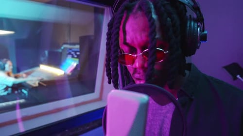 Black Musician Recording Song in Studio