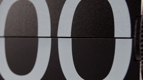 Close-up of Flip Number Board Displaying Digits