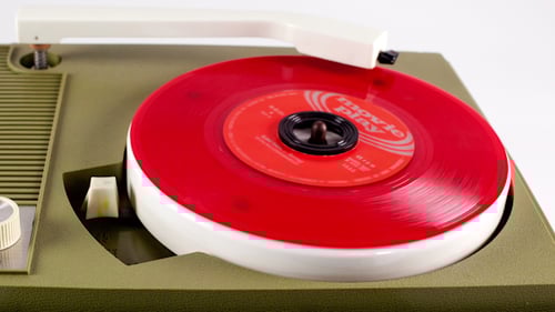 Vintage Portable Record Player Spinning Red Vinyl Record