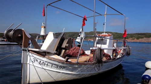 Small Fishing Boat Resting on the Coast
