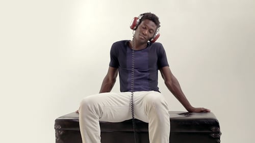 Young Adult Listening to Music on Headphones