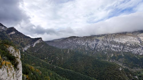 Aerial View of Green Mountains Under Cloudy Sky
