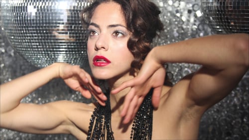 Glamorous Woman Posing with Disco Balls