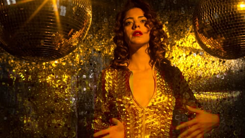 Woman Dancing in Gold Sequins with Disco Balls