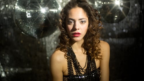 Glamorous Woman Posing with Disco Balls