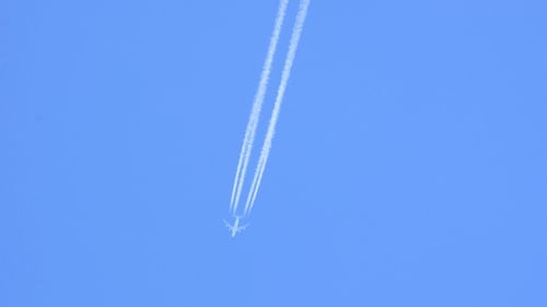 Airplane Flying Upward Leaving White Condensation Trail