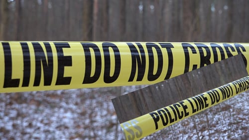Police Line Tape in a Snowy Winter Forest