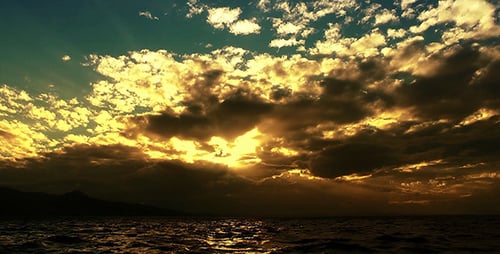 Golden Sunset Over Ocean Water with Flying Birds