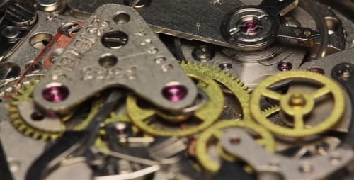 Intricate Watch Gears Turning in Macro Close Up