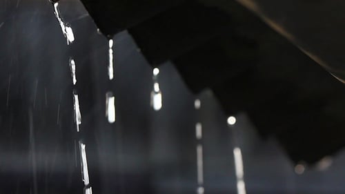 Rain Water Flowing Down the Roof on a Rainy Day