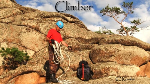 Rock Climber Prepares Rope on Mountainside
