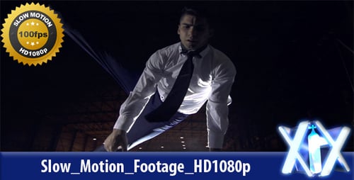 Young Man Acrobat Performing Gymnastics with Blue Fabric