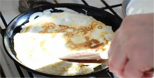 Pancake or Crepe Cooking in a Cast Iron Skillet