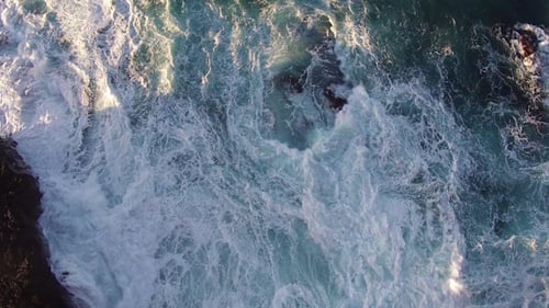 Flying over the Rocks and Ocean Waves