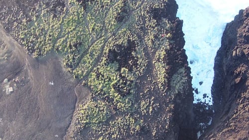 Flying over the Rocks and Ocean Waves