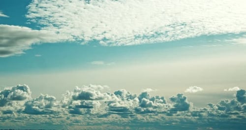 Beautiful Clouds Moving Slowly Across the Blue Sky