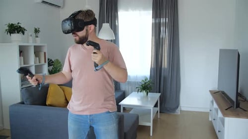 Man Experiencing Virtual Reality in his Modern Living Room