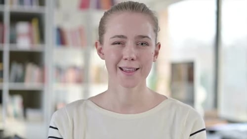 Smiling Woman Gives OK Hand Gesture