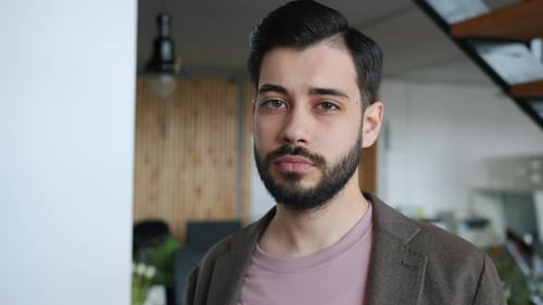 Slow Motion Portrait of Confident Male Employee Bearded Guy Standing in Office Alone