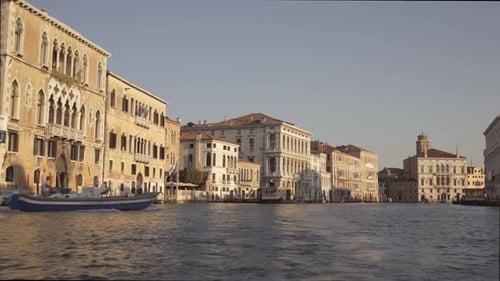 Low angle Wide shot of speed boat cruising morning Canal Grande, Venice, Italy