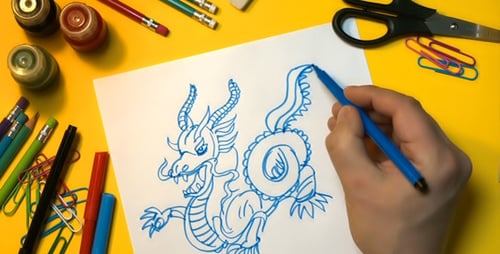 Art Supplies Arranged around a Blank Paper