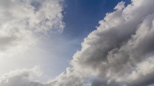 Clouds Moving Across Blue Sky
