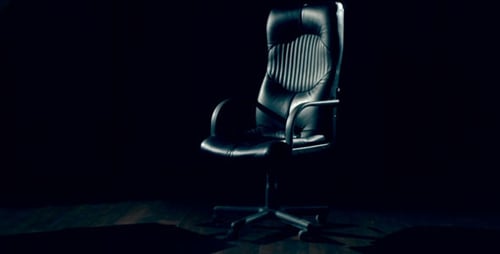 Elegant Black Office Chair in Moody Spotlight