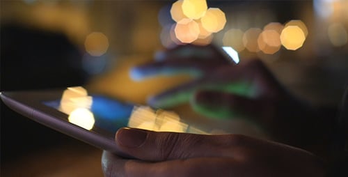 Using Touchscreen Device at Night with Bokeh Lights