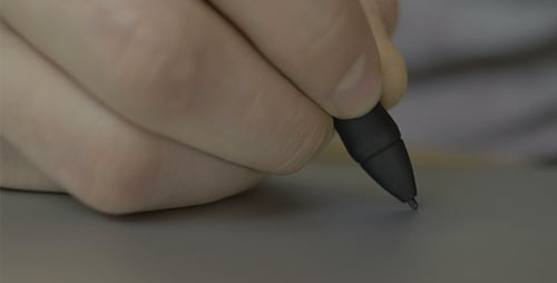 Hand Drawing with Black Pen Close Up