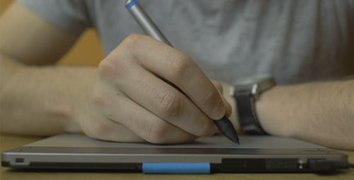Artist Using Stylus Pen on Digital Tablet Device