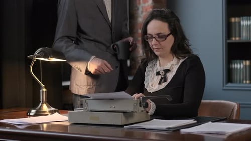 Boss Dictating Text to Secretary to Typewrite