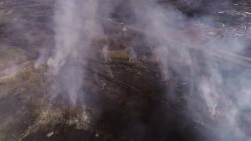 Aerial View of Field Fire with Plumes of Smoke