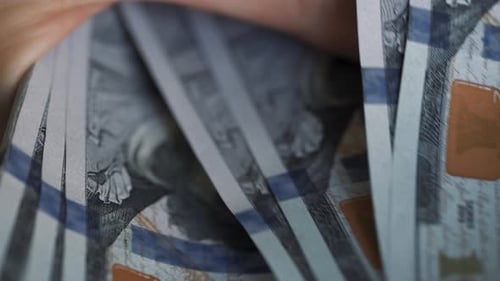 Fingers Count Stack of One Hundred Dollar Bills